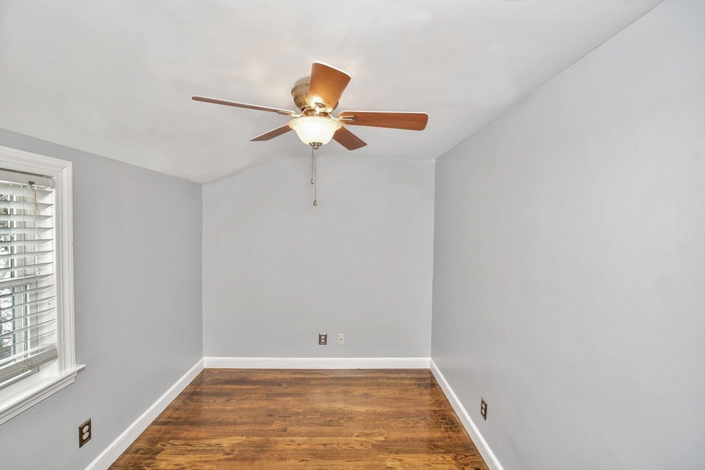 153 Colburn Street Dedham, MA 02026 - Photo 28 of 40 a view of an empty room with a window