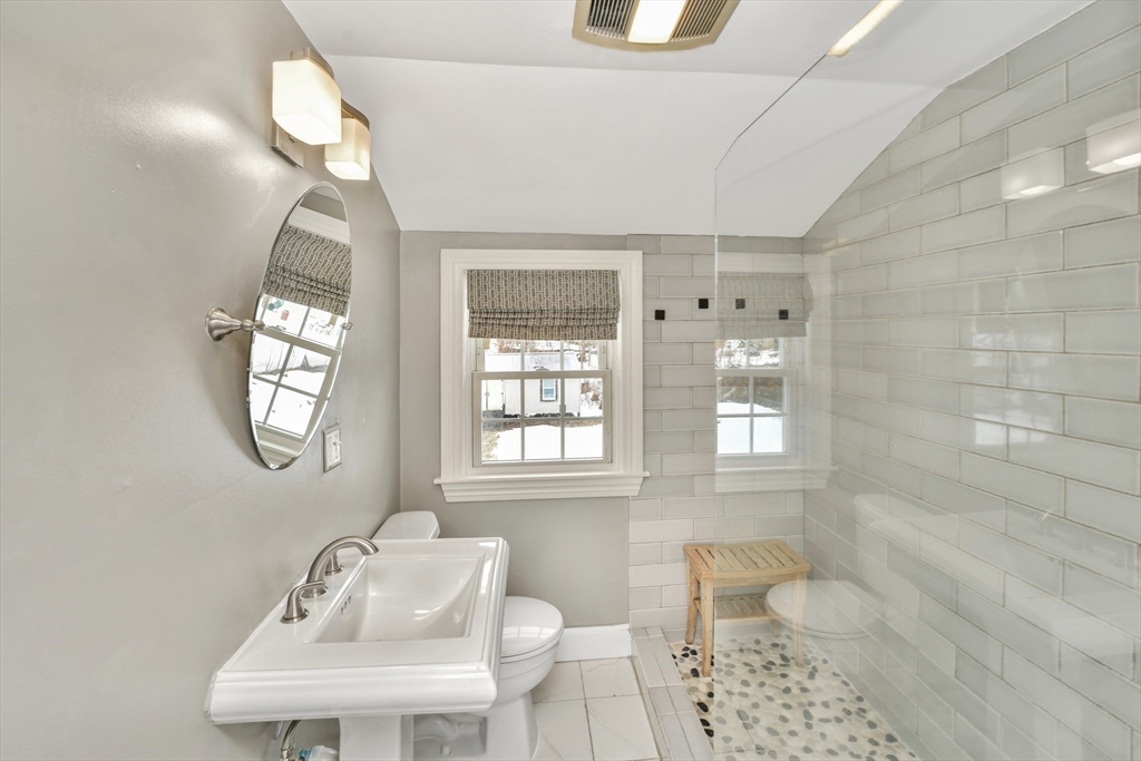 153 Colburn Street Dedham, MA 02026 - Photo 30 of 40 a bathroom with a toilet sink and mirror