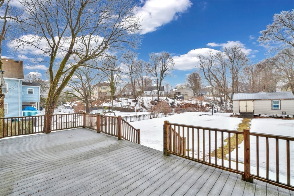 153 Colburn Street Dedham, MA 02026 - Photo 3 of 40 a view of a house with a yard