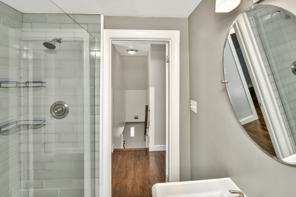 153 Colburn Street Dedham, MA 02026 - Photo 33 of 40 a bathroom with a shower and toilet