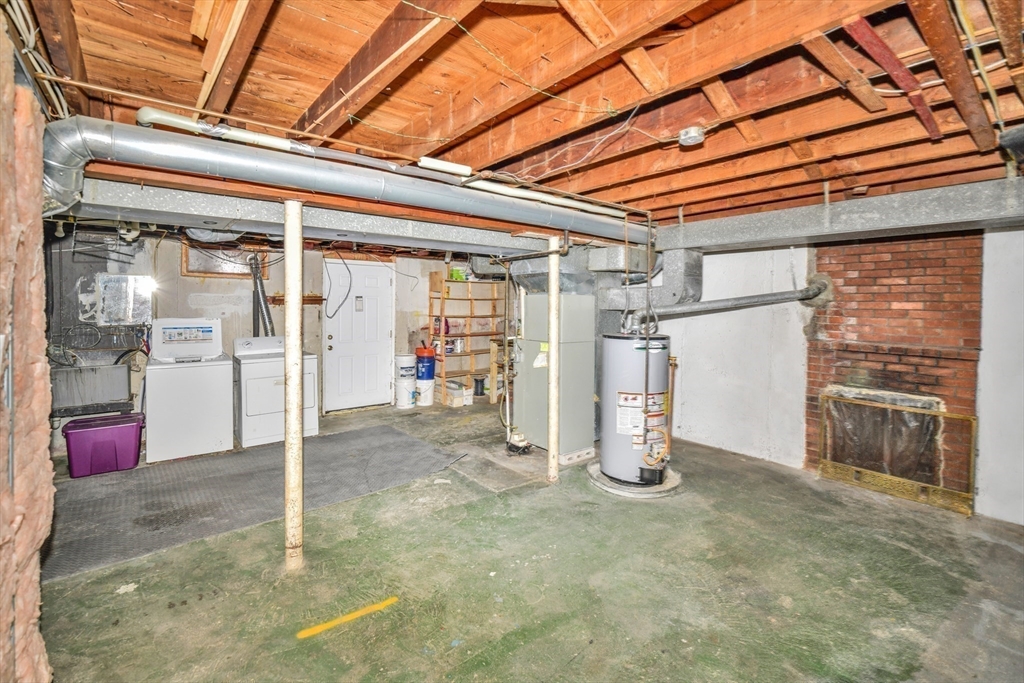 153 Colburn Street Dedham, MA 02026 - Photo 36 of 40 a view of a room with wooden shelves