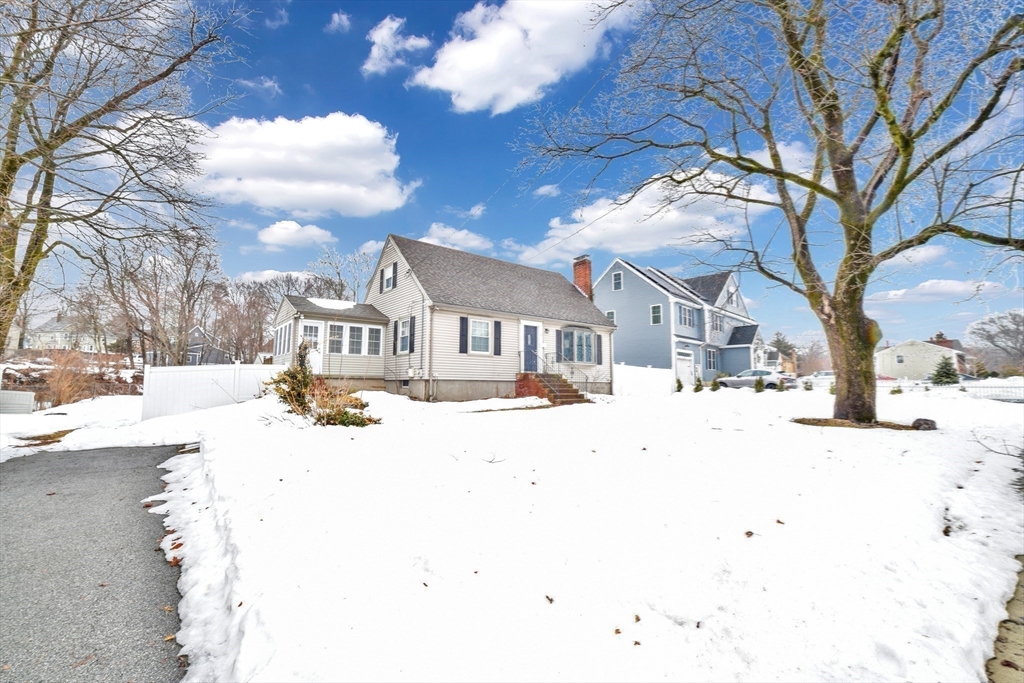153 Colburn Street Dedham, MA 02026 - Photo 40 of 40 a view of a white house with a yard