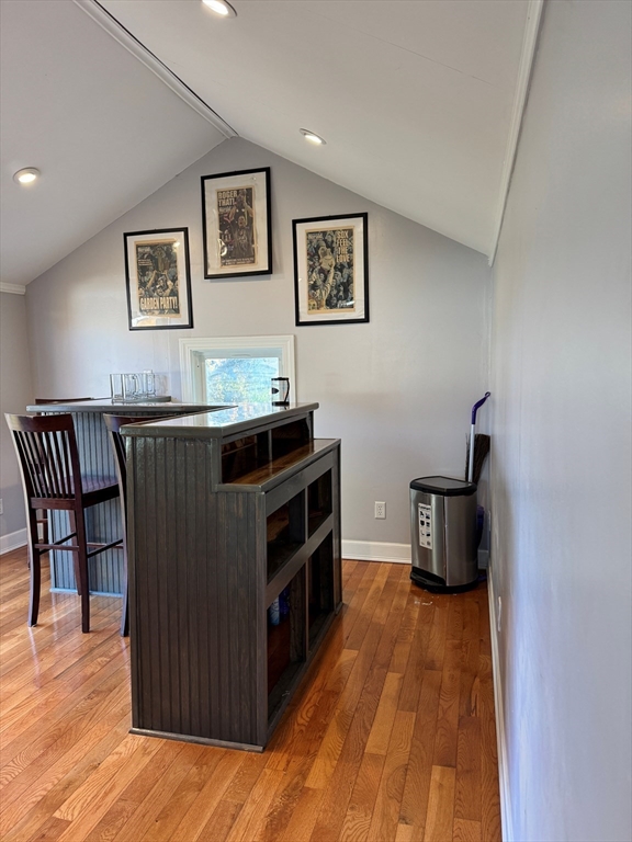 153 Colburn Street Dedham, MA 02026 - Photo 8 of 40 a view of a workspace with furniture and wooden floor