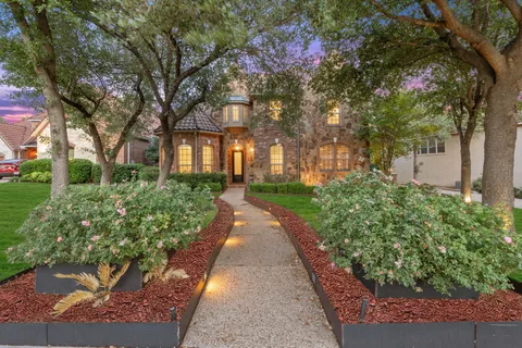 a view of a pathway with a house in the background