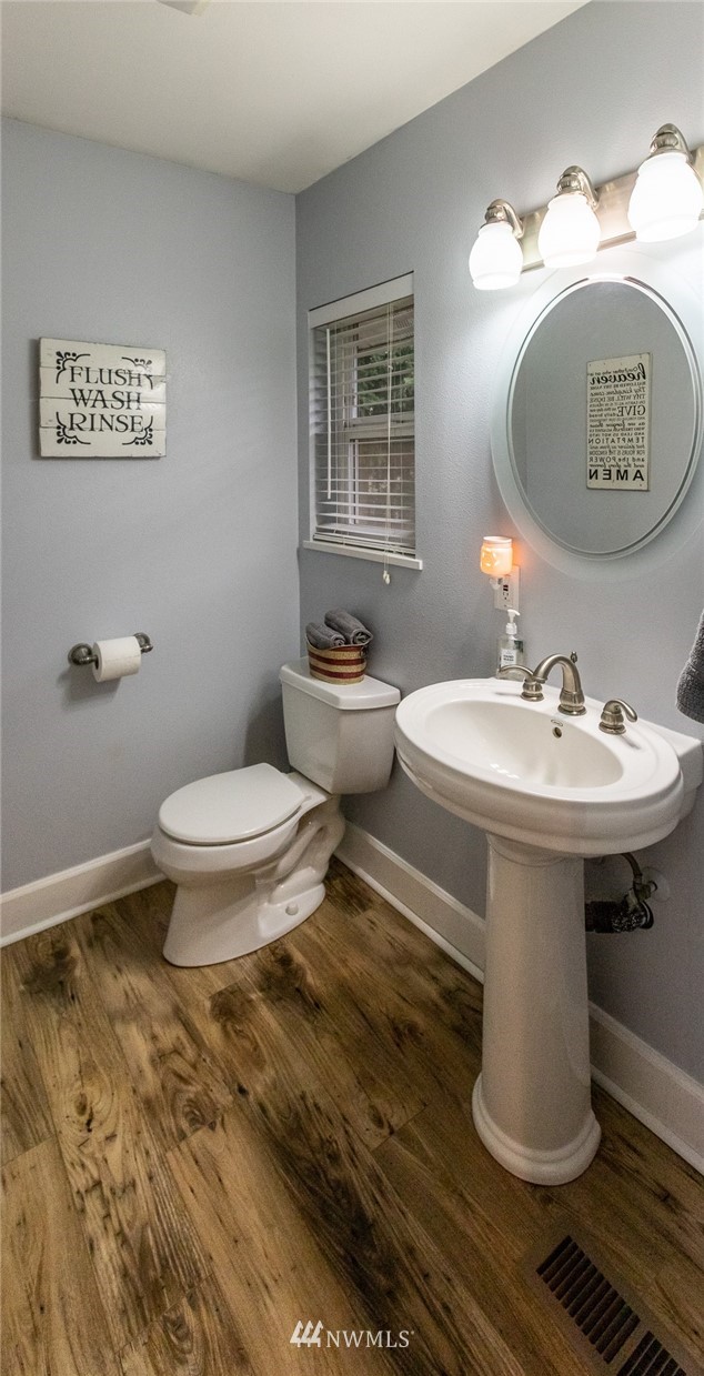 843 Loomis Trail Road Lynden, WA 98264 - Photo 14 of 33 a bathroom with a toilet sink and mirror