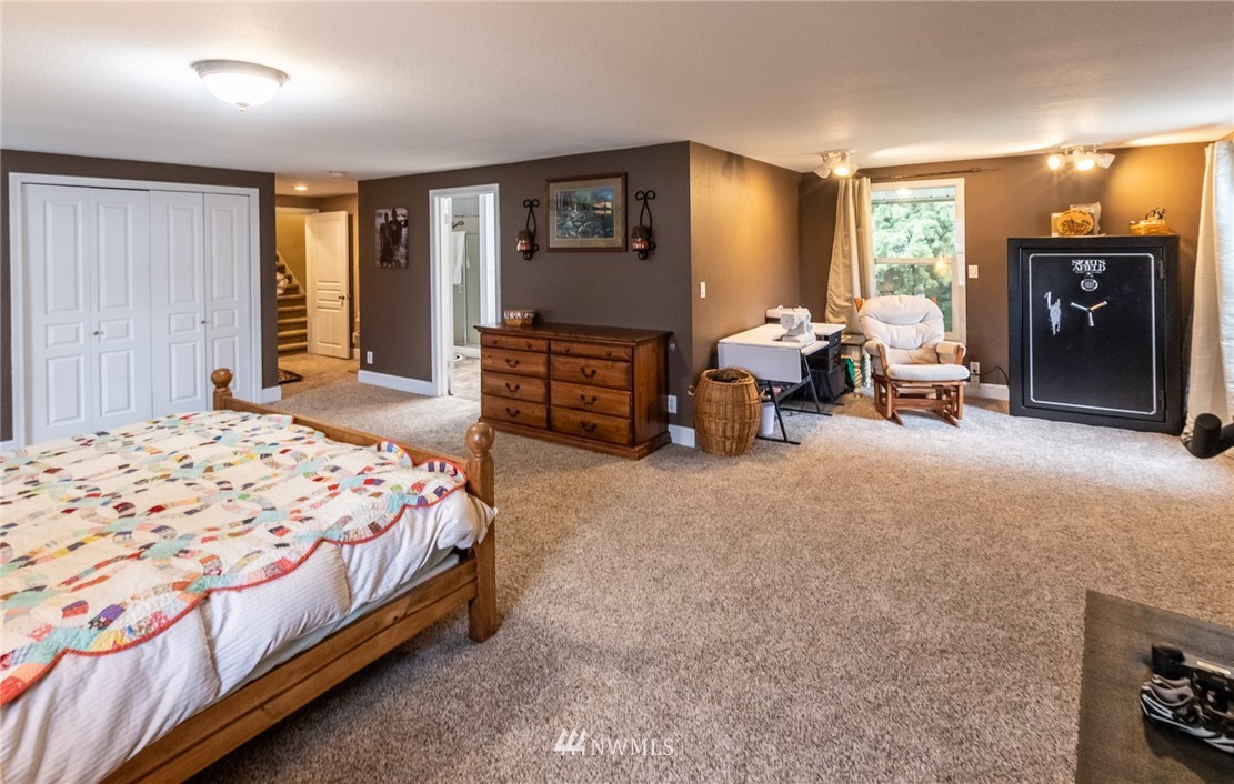 843 Loomis Trail Road Lynden, WA 98264 - Photo 16 of 33 a bed room with a bed and a tv