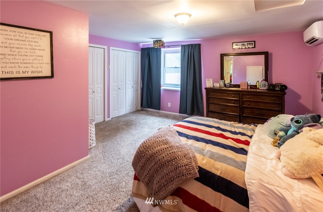 843 Loomis Trail Road Lynden, WA 98264 - Photo 20 of 33 a bedroom with a bed and dresser with mirror