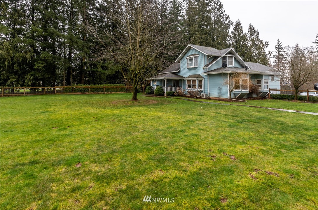 843 Loomis Trail Road Lynden, WA 98264 - Photo 2 of 33 a front of a house with a garden