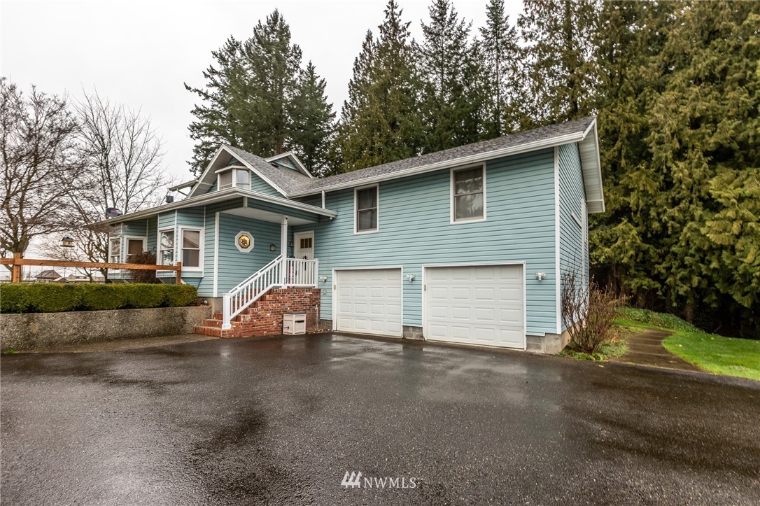 843 Loomis Trail Road Lynden, WA 98264 - Photo 3 of 33 a view of a house with a patio