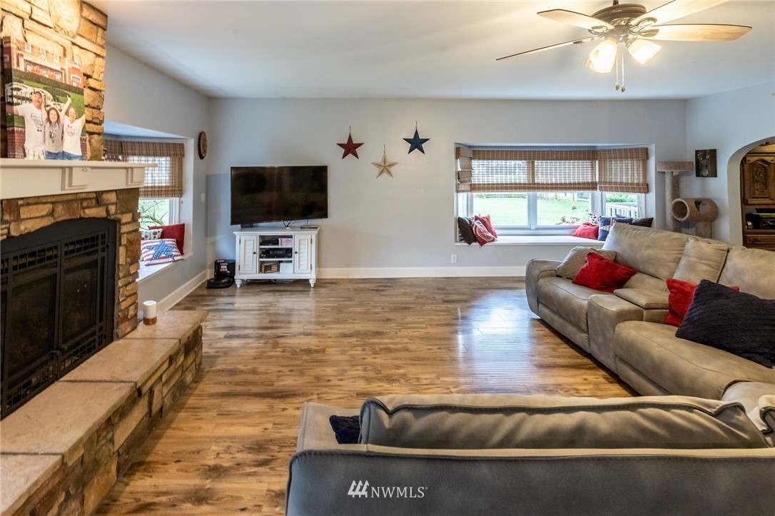 843 Loomis Trail Road Lynden, WA 98264 - Photo 5 of 33 a living room with furniture and a flat screen tv