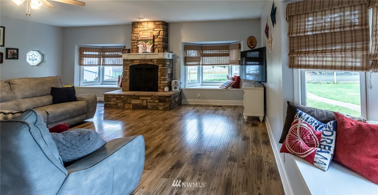 843 Loomis Trail Road Lynden, WA 98264 - Photo 7 of 33 a living room with furniture and a fireplace