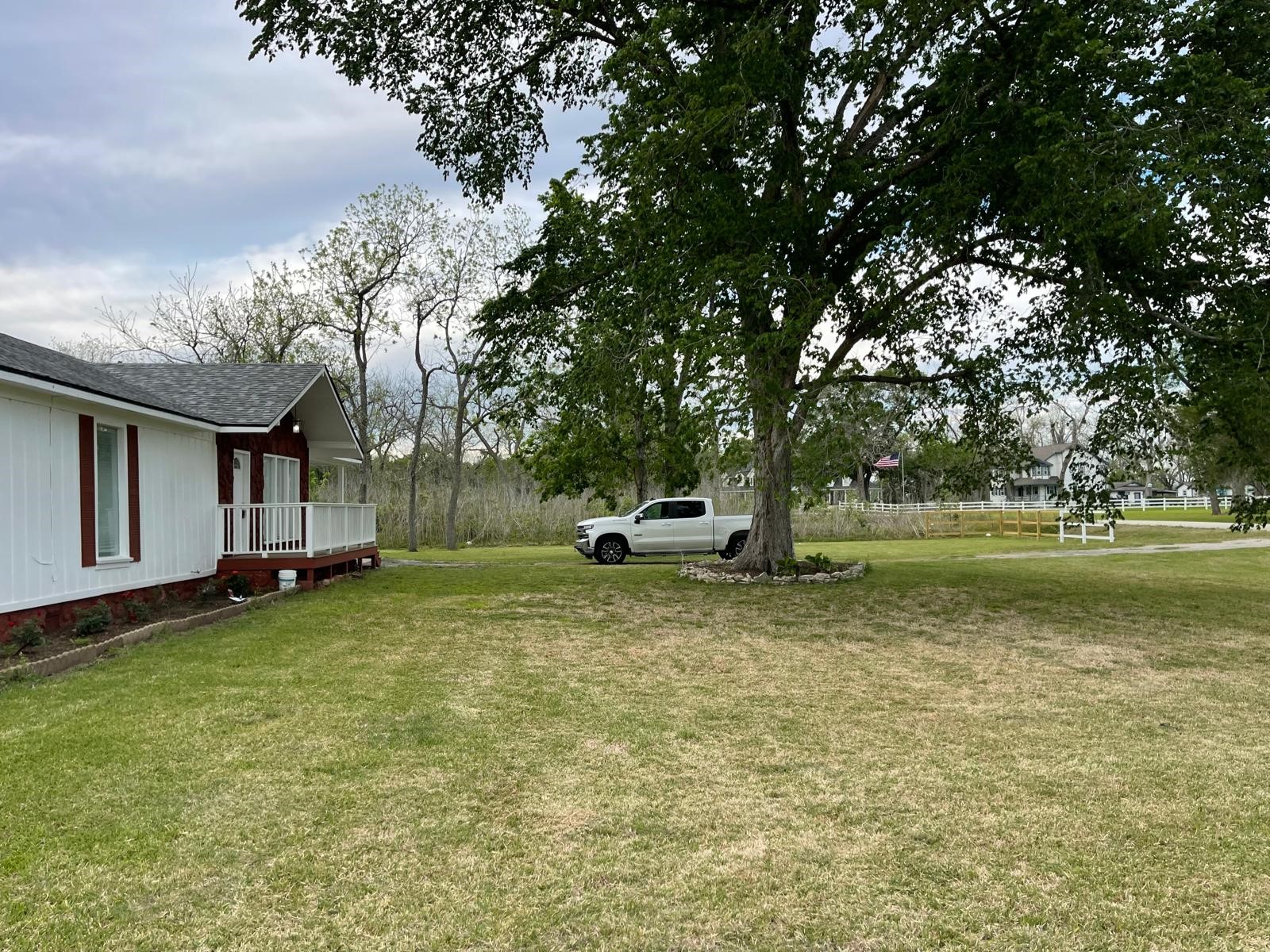 335 Carroll Road Richmond, TX 77469 - Photo 2 of 25 a swimming pool with outdoor seating and yard