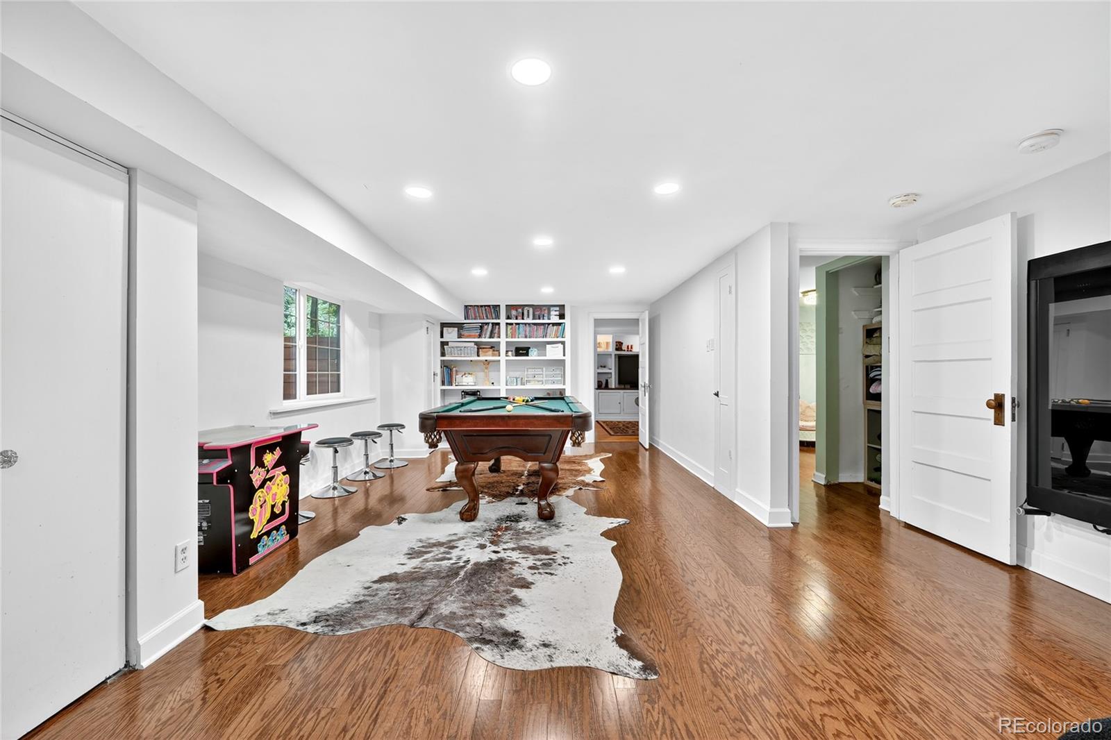 1750 Jasmine Street Denver, CO 80220 - Photo 19 of 35 a living room with furniture and a wooden floor