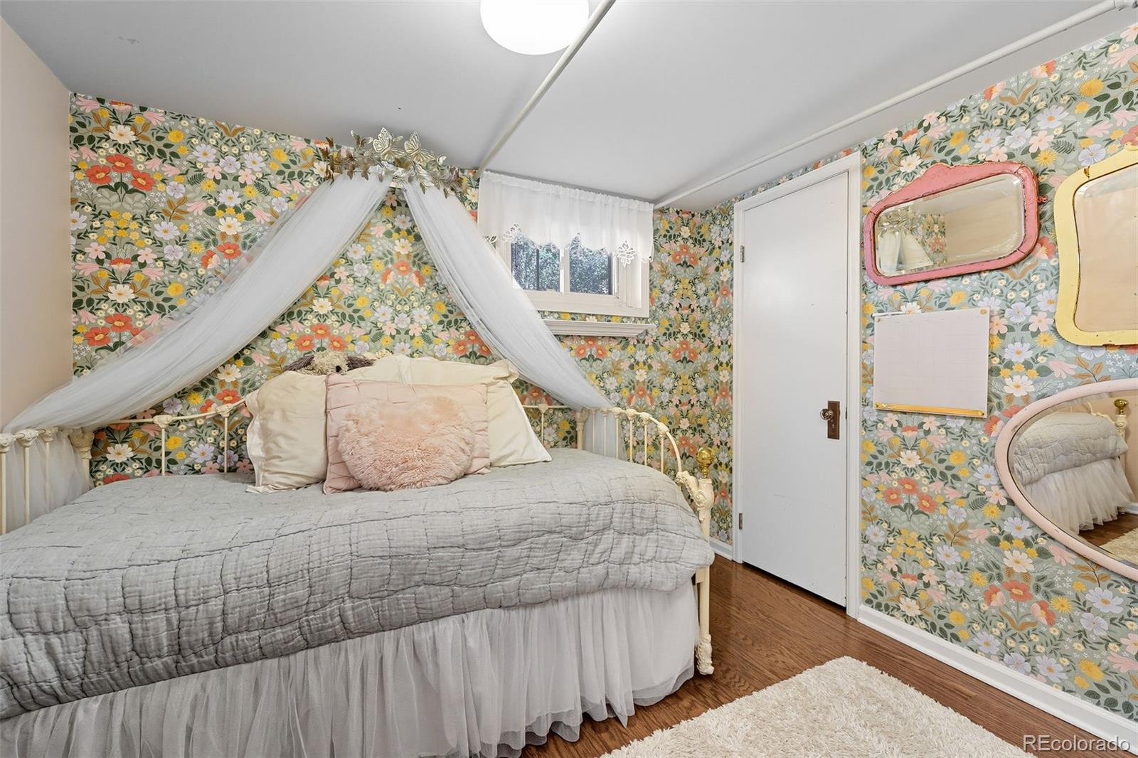 1750 Jasmine Street Denver, CO 80220 - Photo 26 of 35 a bedroom with a bed and a window