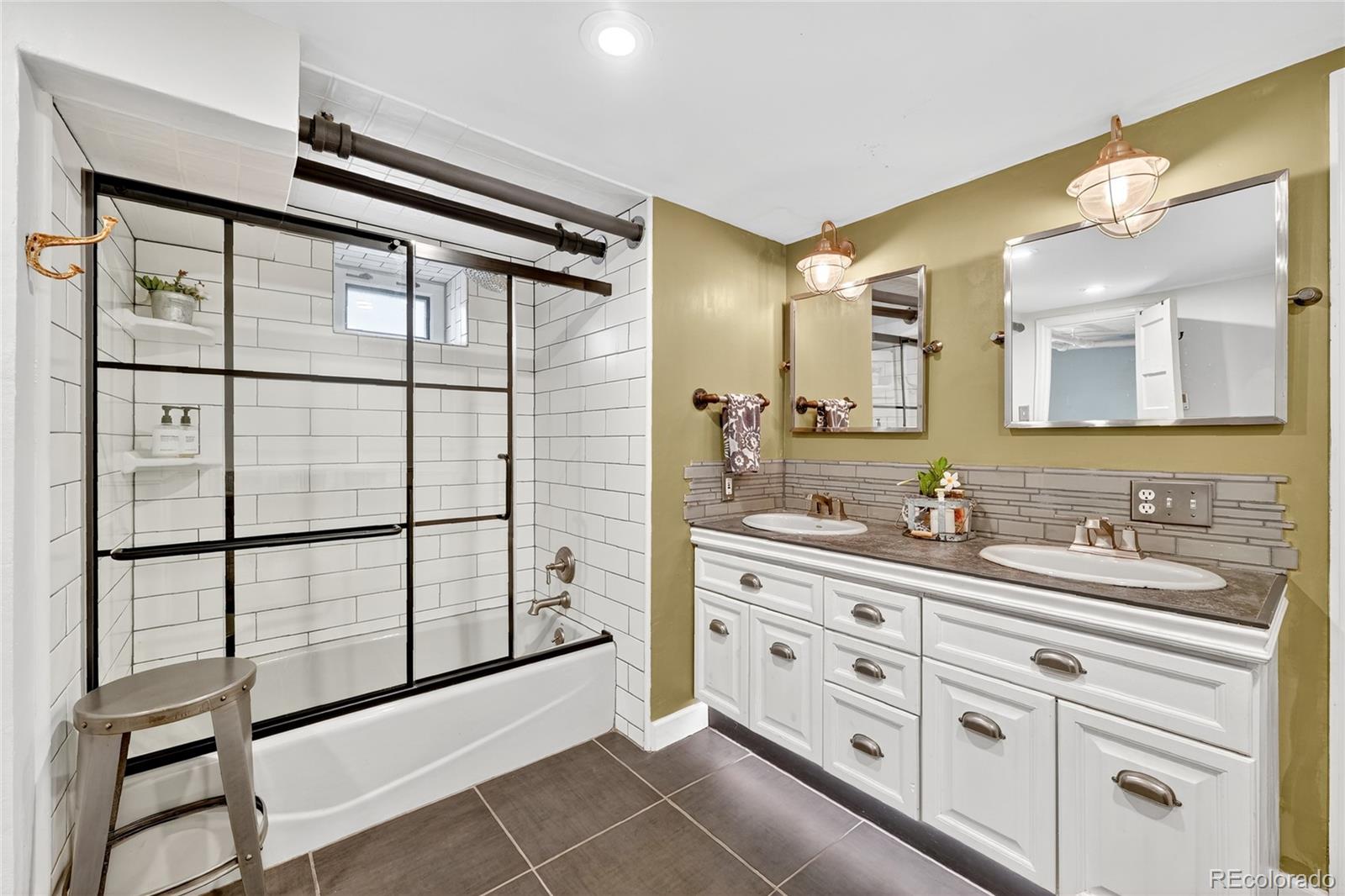 1750 Jasmine Street Denver, CO 80220 - Photo 27 of 35 a bathroom with a double vanity sink mirror and