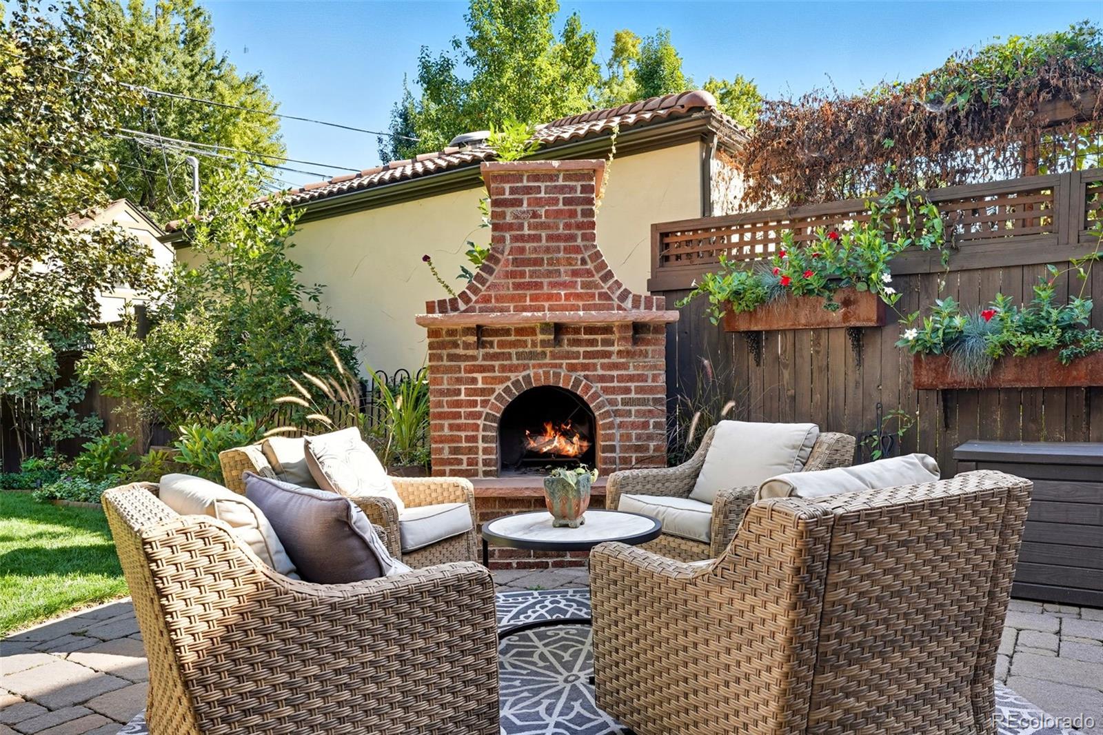 1750 Jasmine Street Denver, CO 80220 - Photo 29 of 35 a view of a patio with couches chairs and a fire pit