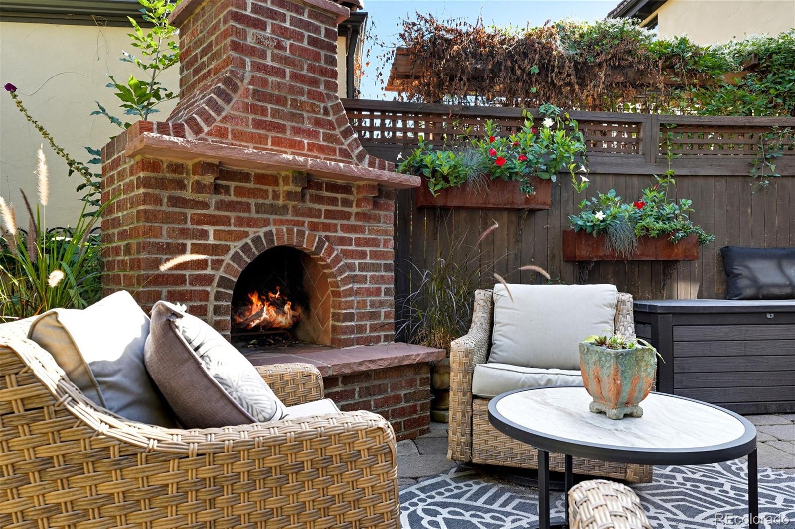 1750 Jasmine Street Denver, CO 80220 - Photo 30 of 35 a outdoor living space with furniture and a fireplace