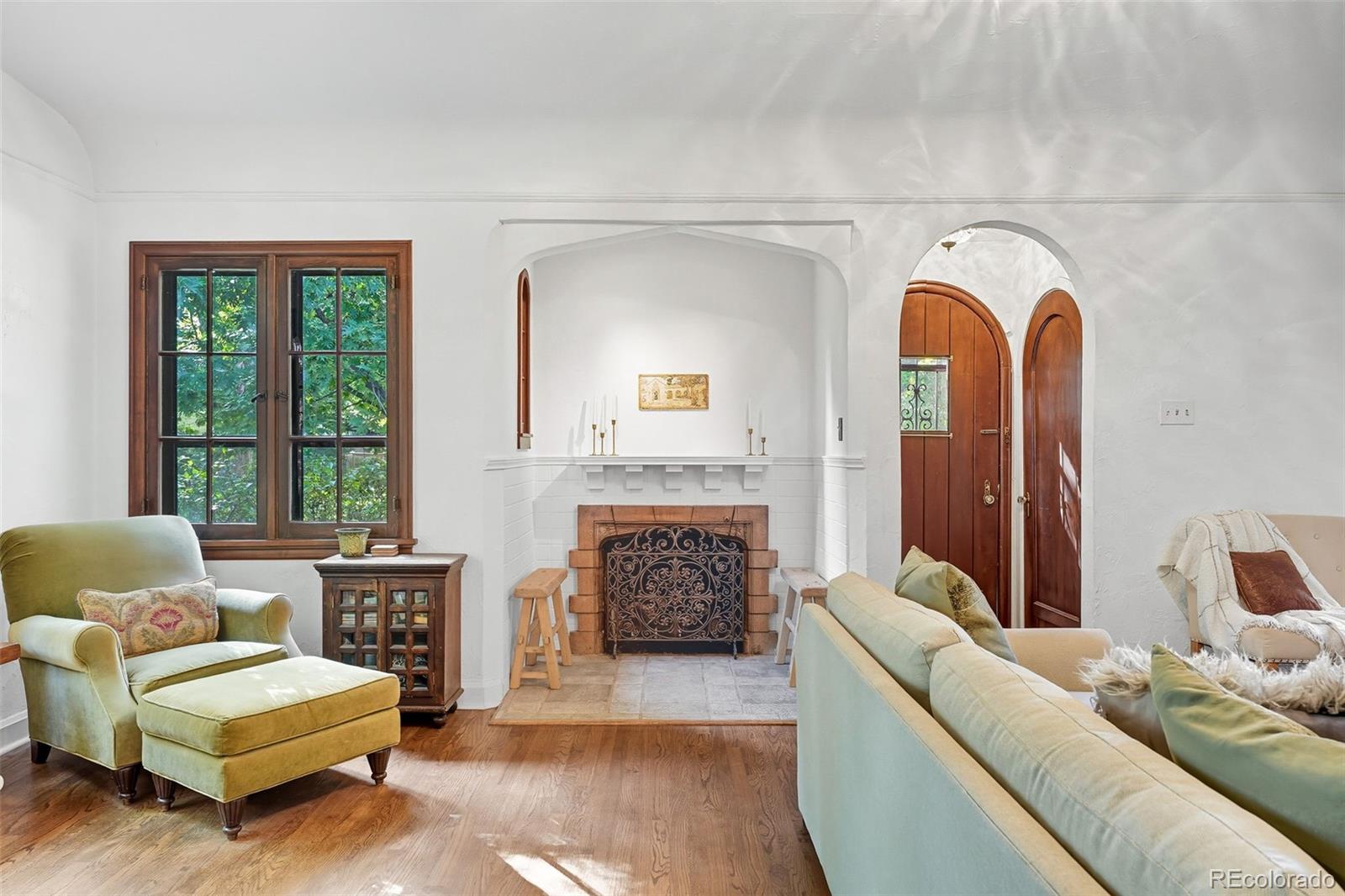 1750 Jasmine Street Denver, CO 80220 - Photo 3 of 35 a living room with furniture and a fireplace