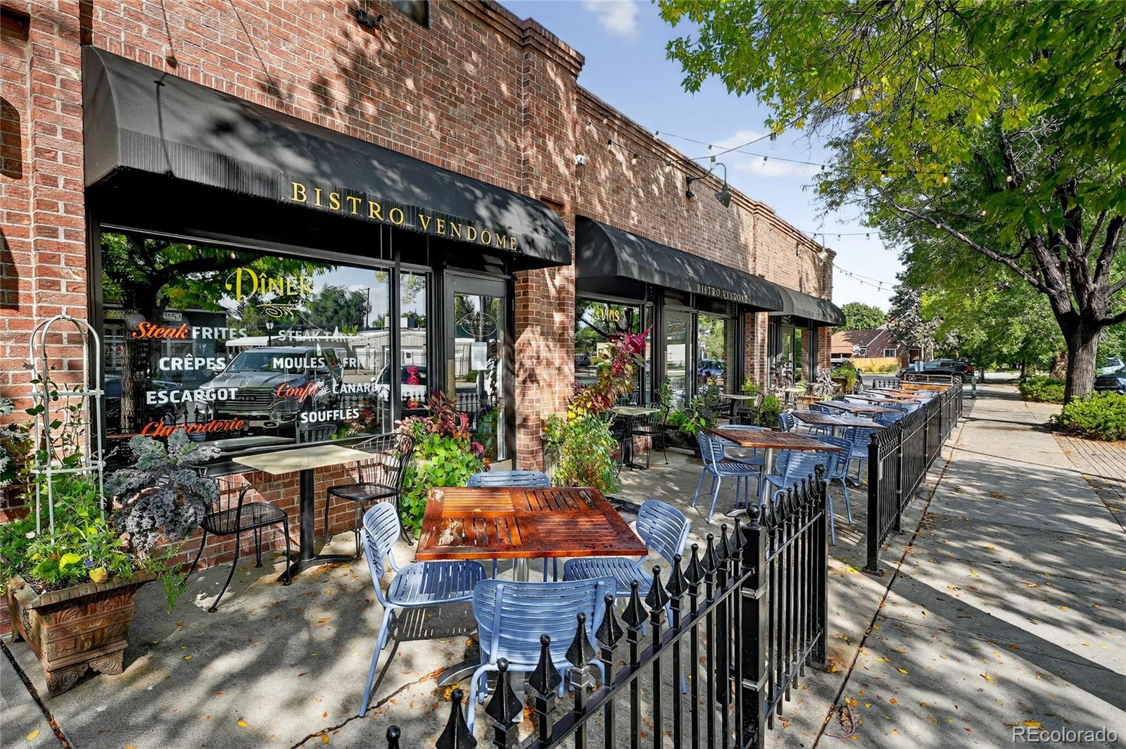 1750 Jasmine Street Denver, CO 80220 - Photo 34 of 35 a view of a patio with table and chairs potted plants and floor to ceiling window