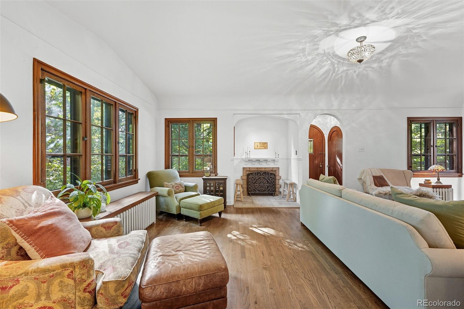 1750 Jasmine Street Denver, CO 80220 - Photo 5 of 35 a living room with furniture and a large window