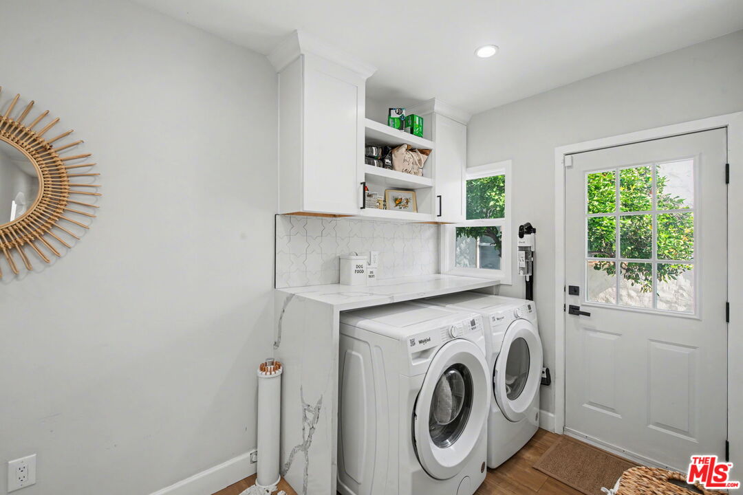 1135 West 81st Place Los Angeles, CA 90044 - Photo 12 of 28 a utility room with dryer and washer