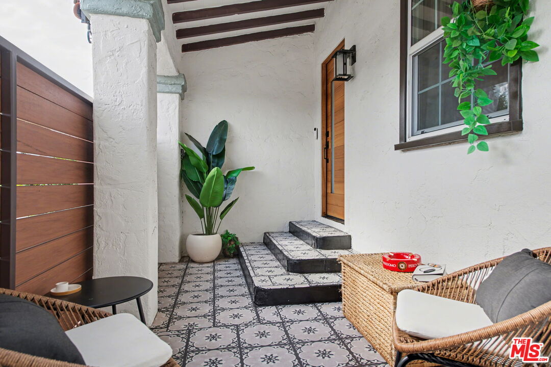 1135 West 81st Place Los Angeles, CA 90044 - Photo 3 of 28 a living room with furniture and a potted plant