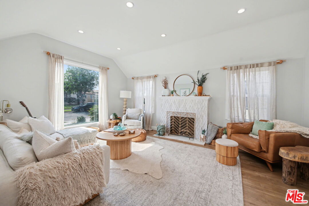 1135 West 81st Place Los Angeles, CA 90044 - Photo 5 of 28 a living room with furniture and a fireplace