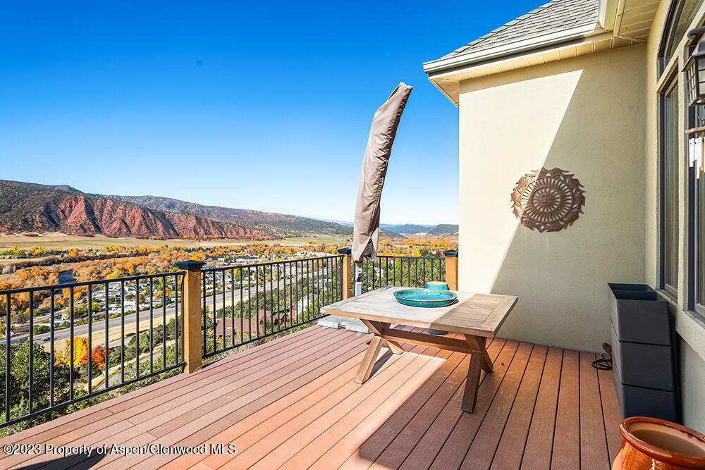 587 Hillcrest Drive Basalt, CO 81621 - Photo 14 of 29 a view of balcony with wooden floor and outdoor seating