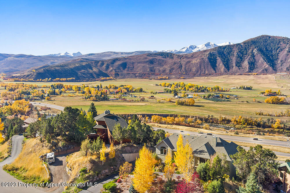 587 Hillcrest Drive Basalt, CO 81621 - Photo 2 of 29 a view of a swimming pool with mountains in the background