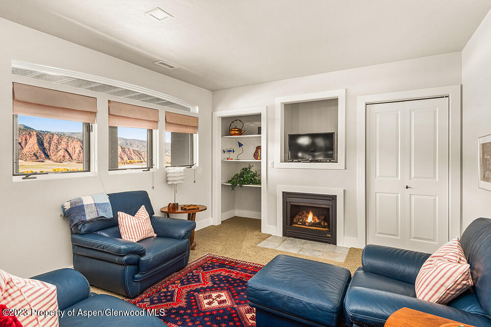 587 Hillcrest Drive Basalt, CO 81621 - Photo 22 of 29 a living room with furniture fireplace and window