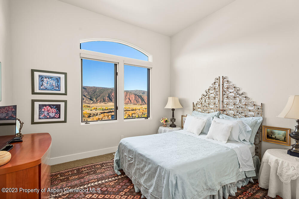 587 Hillcrest Drive Basalt, CO 81621 - Photo 23 of 29 a bedroom with a bed and a window