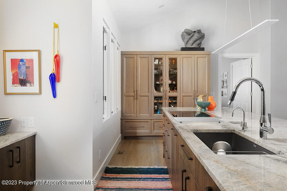 587 Hillcrest Drive Basalt, CO 81621 - Photo 7 of 29 a kitchen with granite countertop a sink stainless steel appliances and cabinets