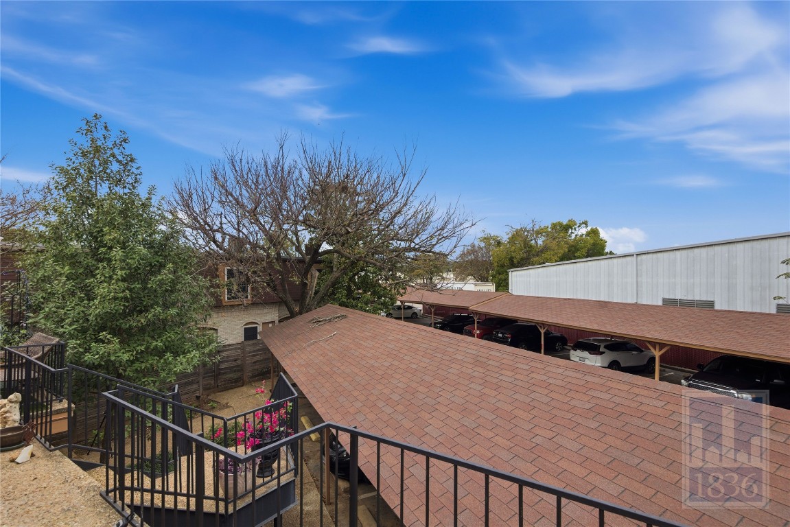 7801 Shoal Creek Boulevard, Unit 256 Austin, TX 78757 - Photo 19 of 27 a view of a balcony with wooden floor and fence