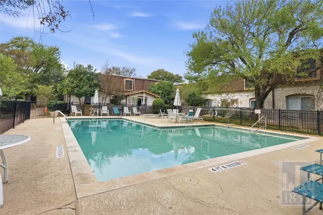 a view of a swimming pool with a patio