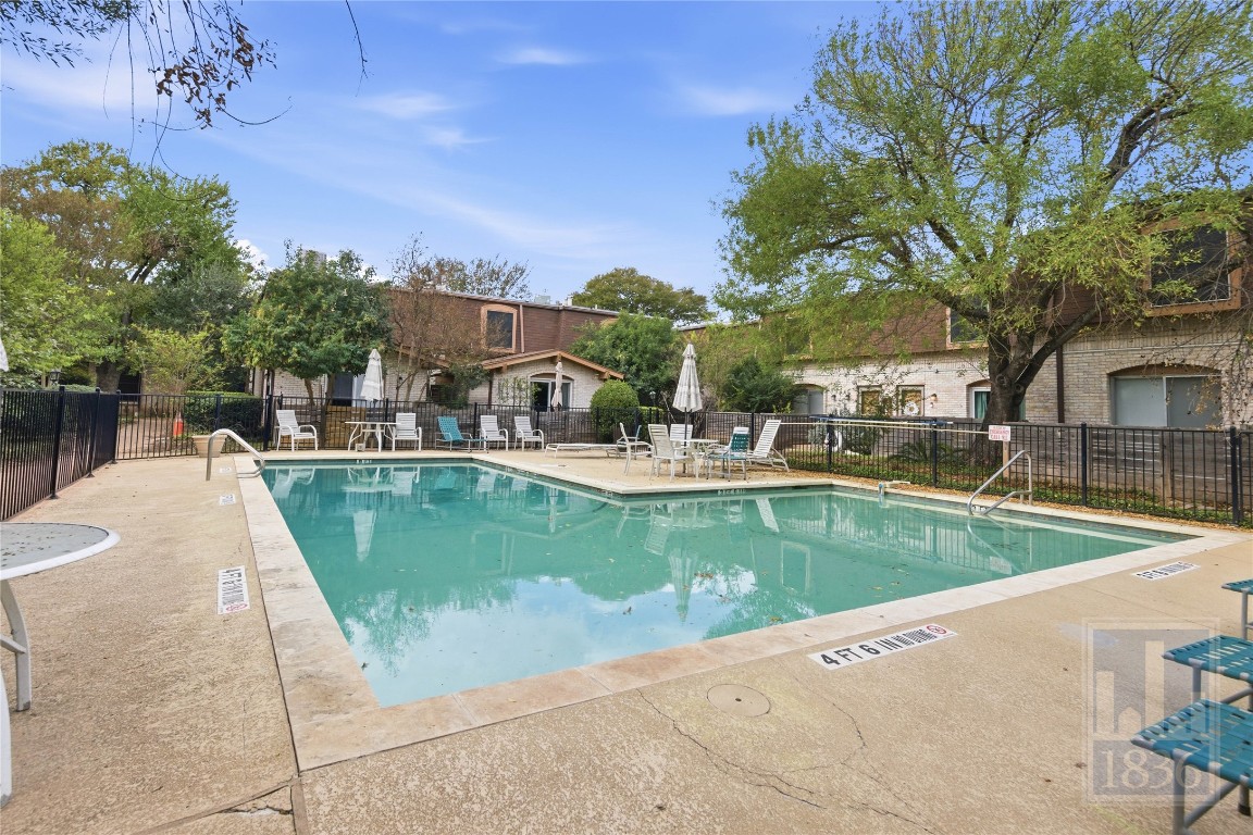 7801 Shoal Creek Boulevard, Unit 256 Austin, TX 78757 - Photo 25 of 27 a view of a swimming pool with a patio