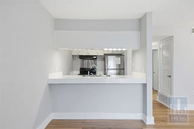 a view of living room with granite countertop furniture and fireplace