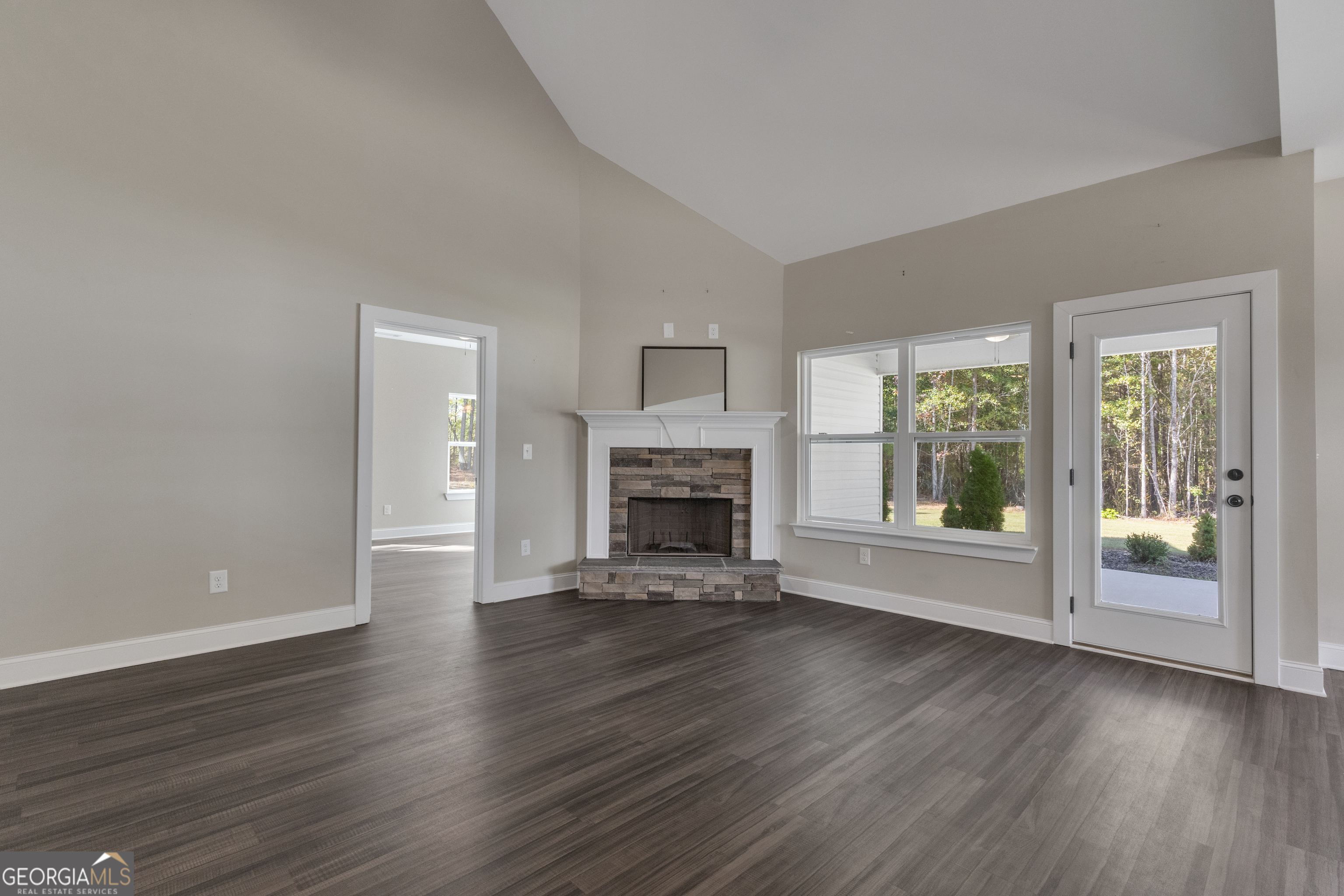 2114 Allie Road Greenville, GA 30222 - Photo 13 of 48 a view of an empty room with wooden floor and a window