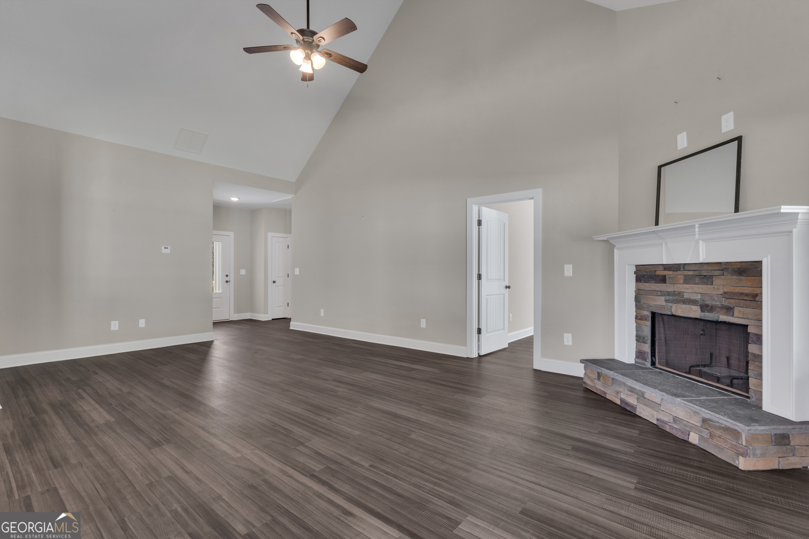 2114 Allie Road Greenville, GA 30222 - Photo 14 of 48 a view of an empty room with wooden floor fireplace and a window