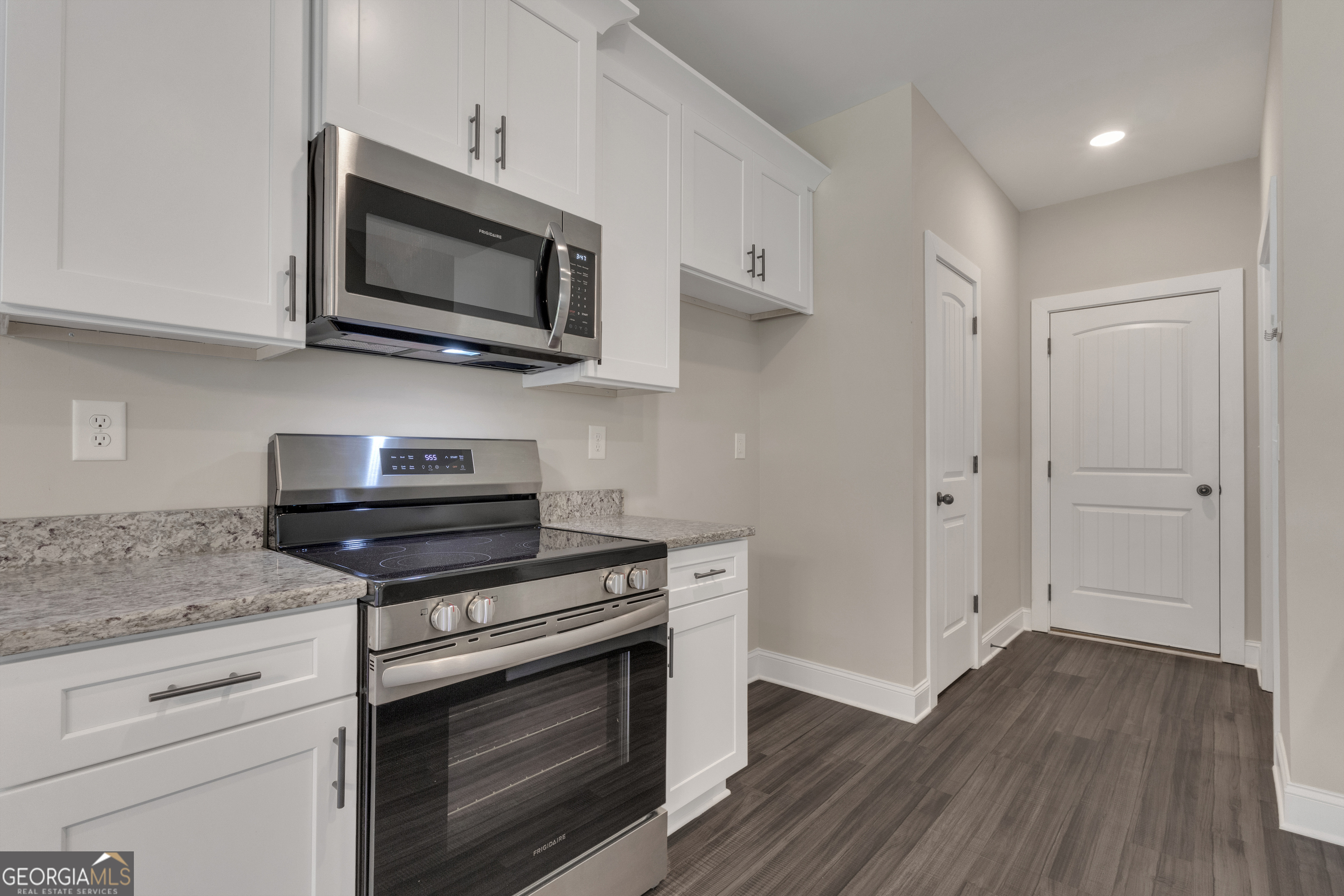 2114 Allie Road Greenville, GA 30222 - Photo 17 of 48 a kitchen with stainless steel appliances granite countertop a stove microwave and sink