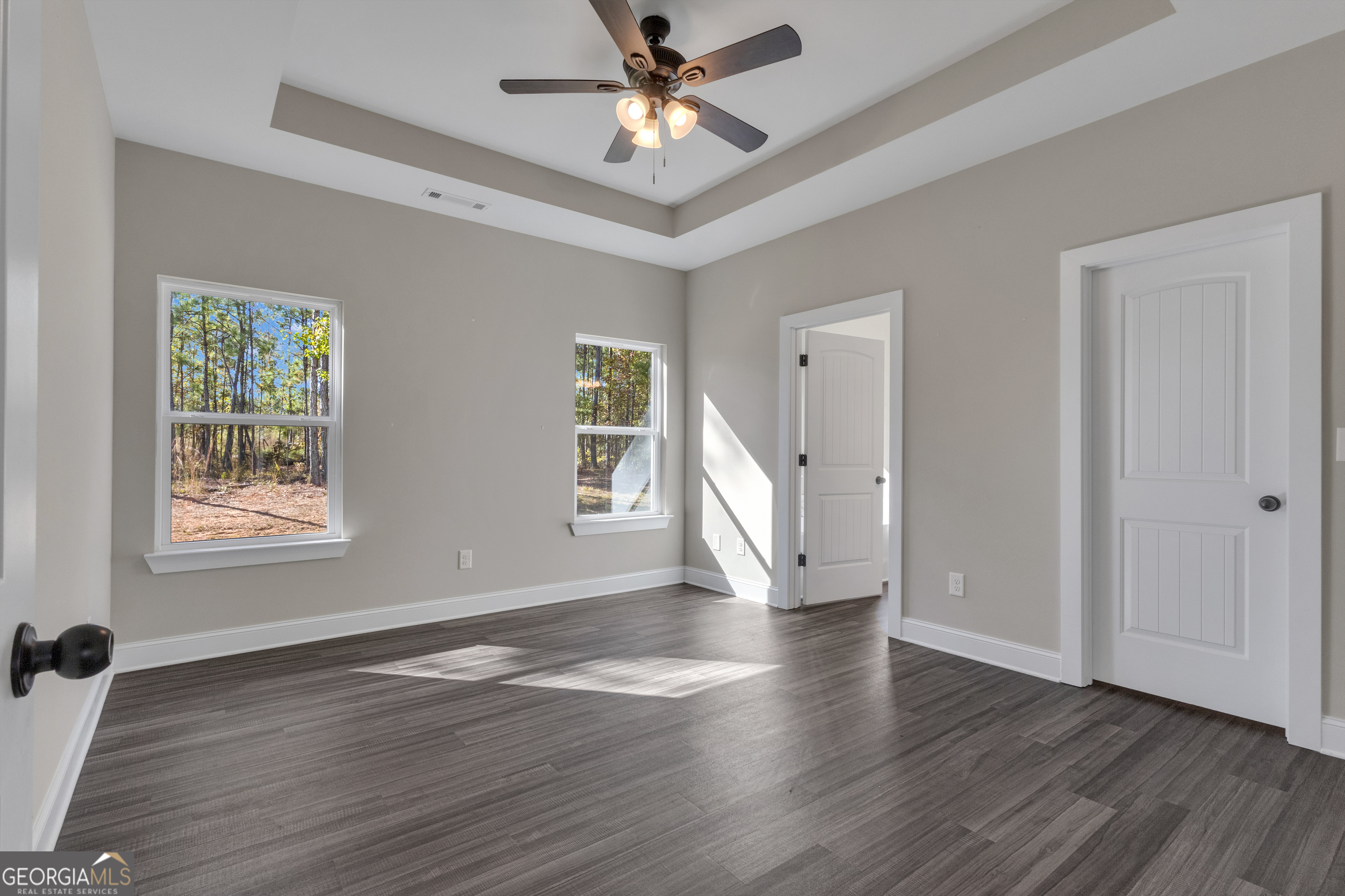 2114 Allie Road Greenville, GA 30222 - Photo 20 of 48 a view of an empty room with wooden floor and a window