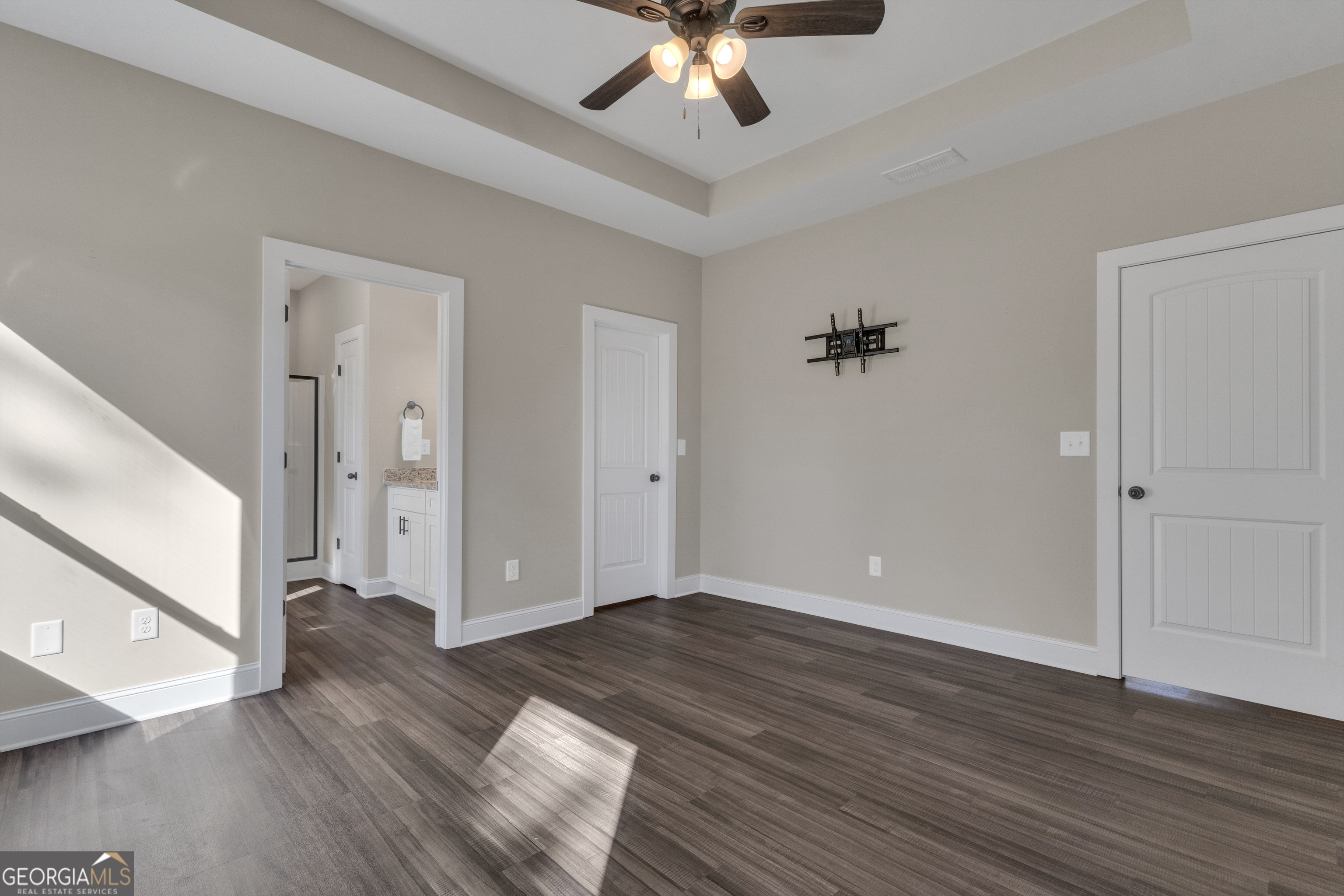 2114 Allie Road Greenville, GA 30222 - Photo 21 of 48 an empty room with wooden floor and a ceiling fan