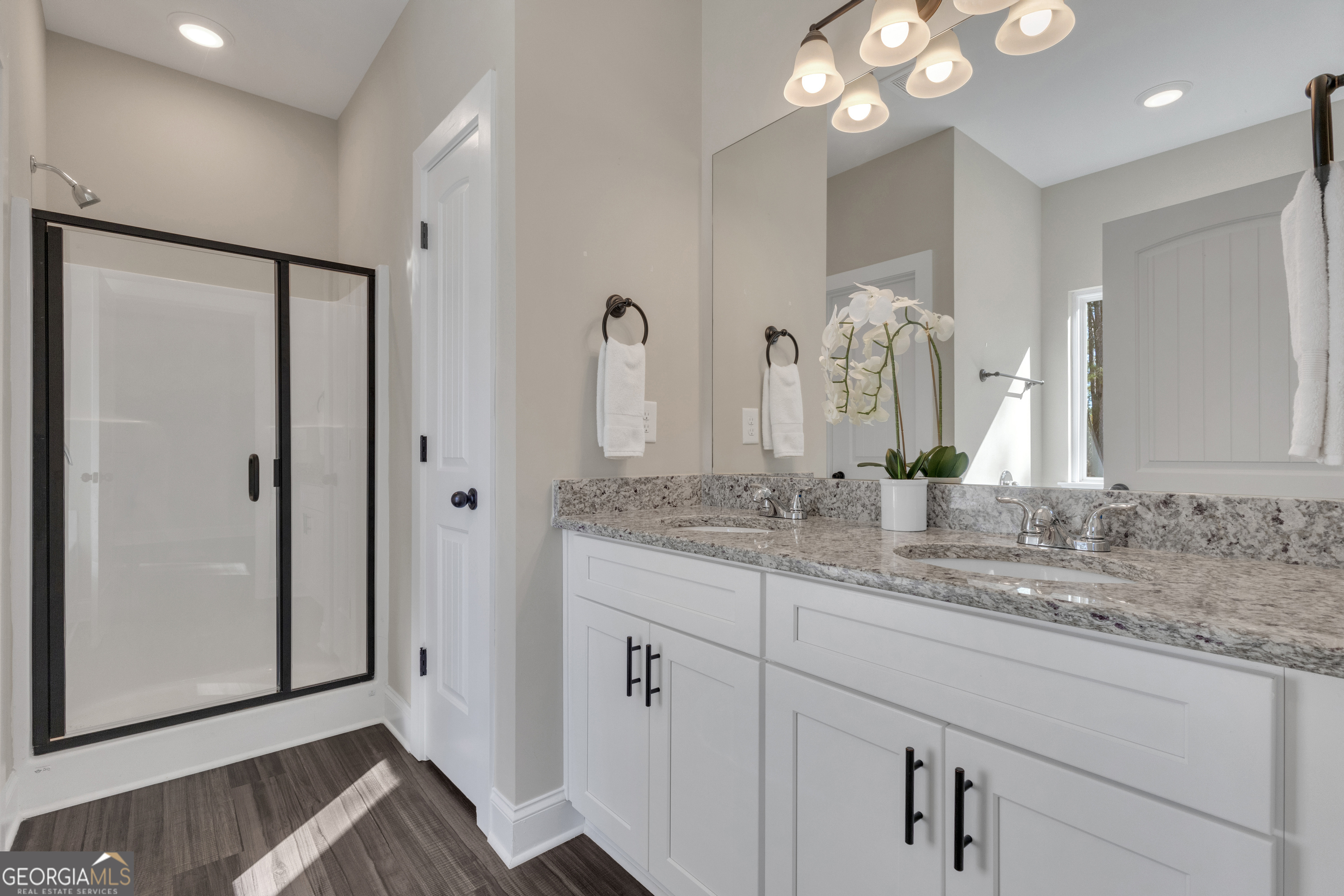 2114 Allie Road Greenville, GA 30222 - Photo 23 of 48 a bathroom with a granite countertop sink a large mirror and a shower