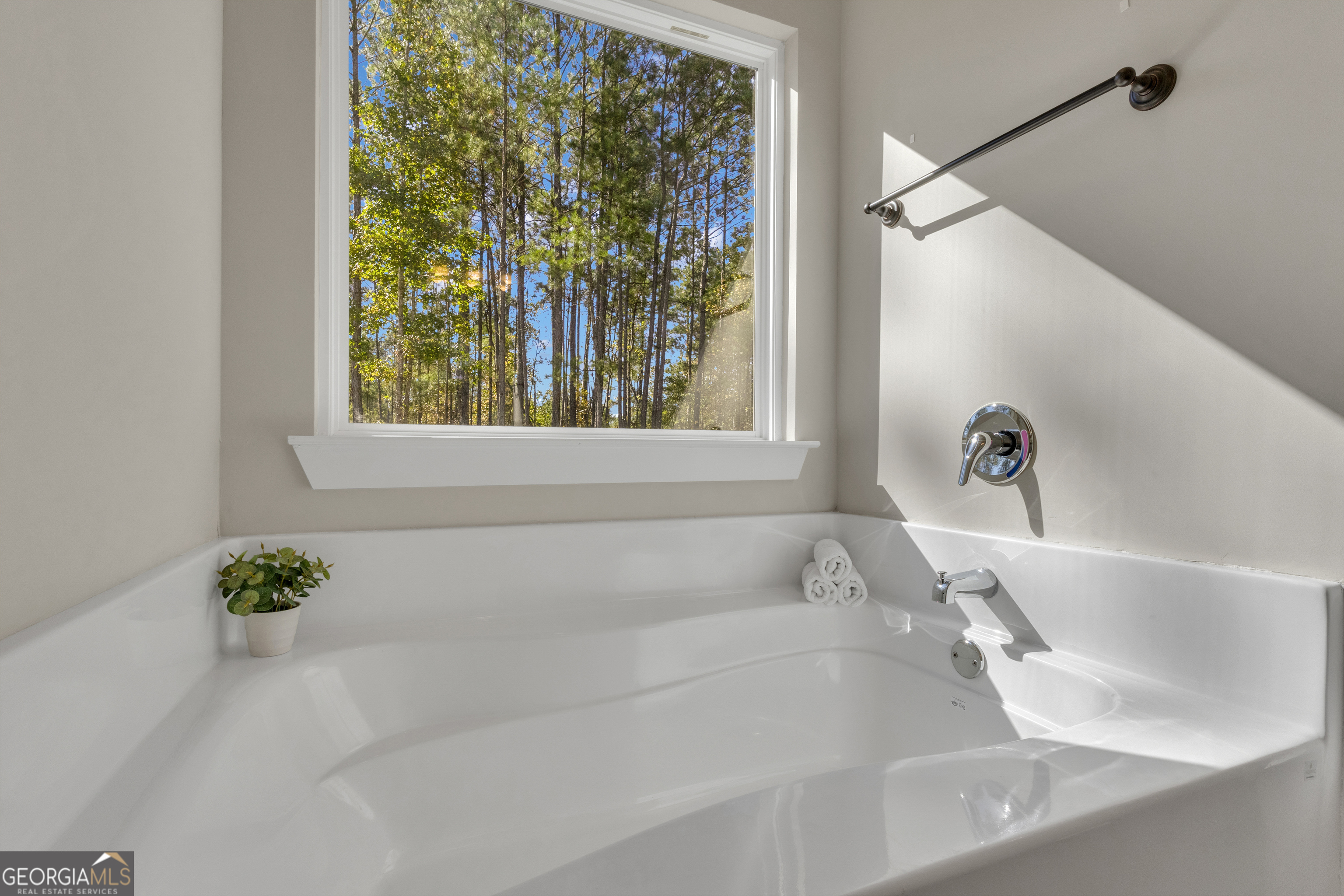 2114 Allie Road Greenville, GA 30222 - Photo 24 of 48 a white bath tub sitting in a bathroom next to a window