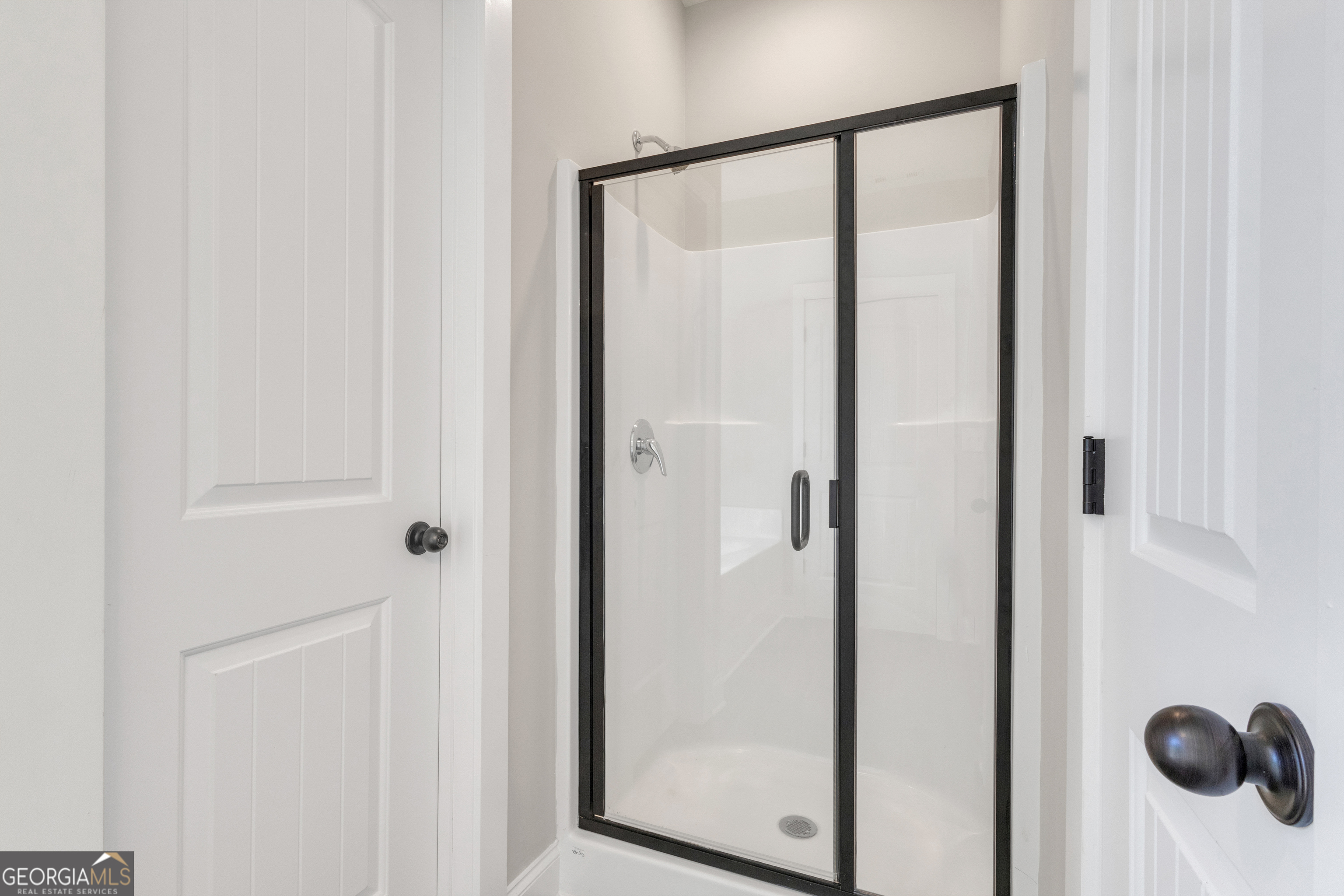 2114 Allie Road Greenville, GA 30222 - Photo 25 of 48 a bathroom with a glass shower door