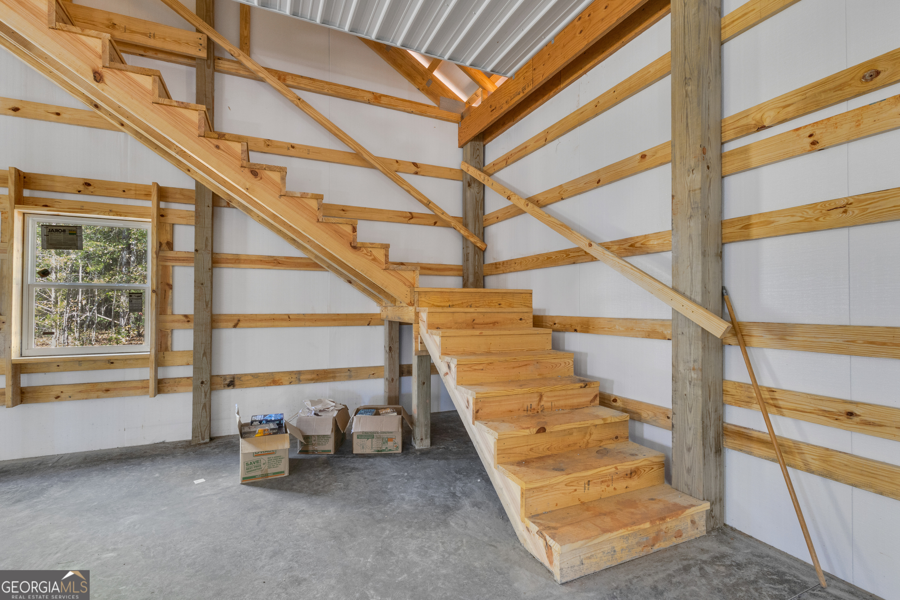 2114 Allie Road Greenville, GA 30222 - Photo 39 of 48 a view of staircase with a rug and a large window