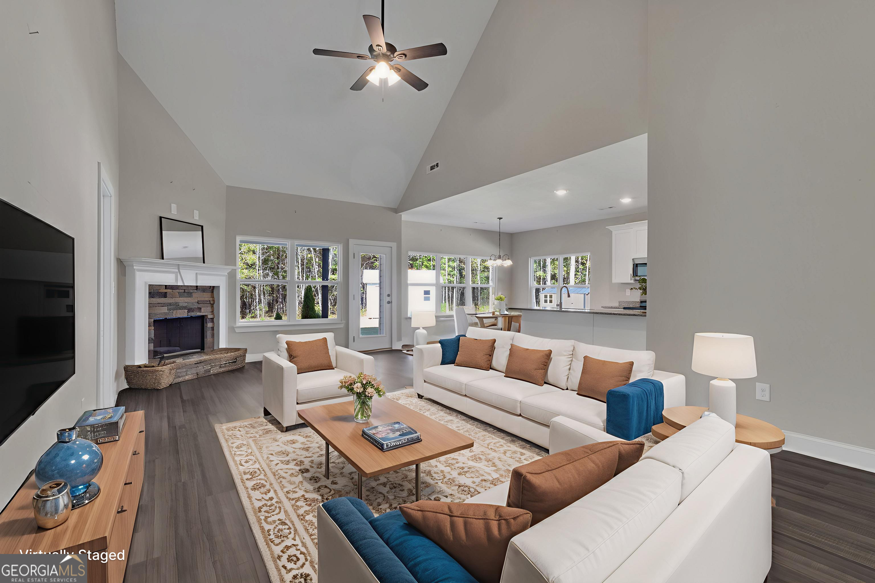 2114 Allie Road Greenville, GA 30222 - Photo 5 of 48 a living room with furniture a flat screen tv and a fireplace