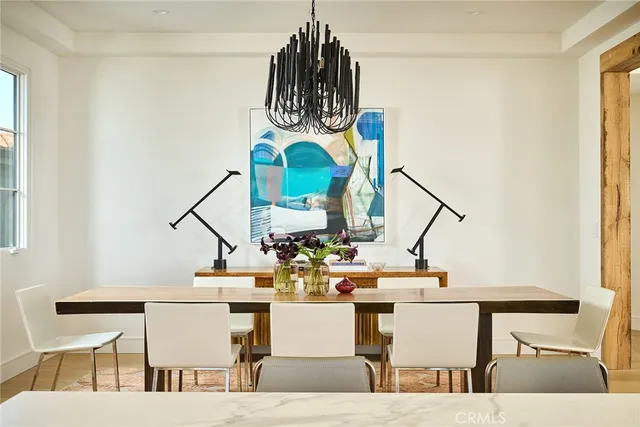 a living room with furniture a dining table and a fireplace