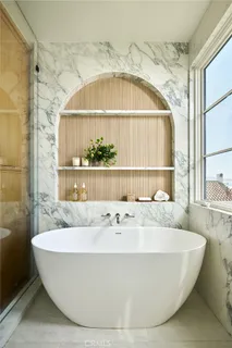 a bathroom with a double vanity sink mirror and shower