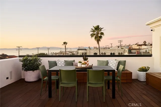 a terrace with outdoor seating and city view