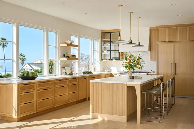 a kitchen with a table and chairs in it